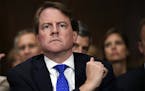 Then-White House counsel Don McGahn listens as Supreme court nominee Brett Kavanaugh testifies before the Senate Judiciary Committee on Capitol Hill i
