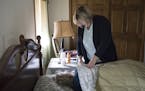 Heather Boldon gave her mother Karen Boldon medicine as she took a nap at their home in Farmington, Minn., on April 14, 2017. ] RENEE JONES SCHNEIDER 