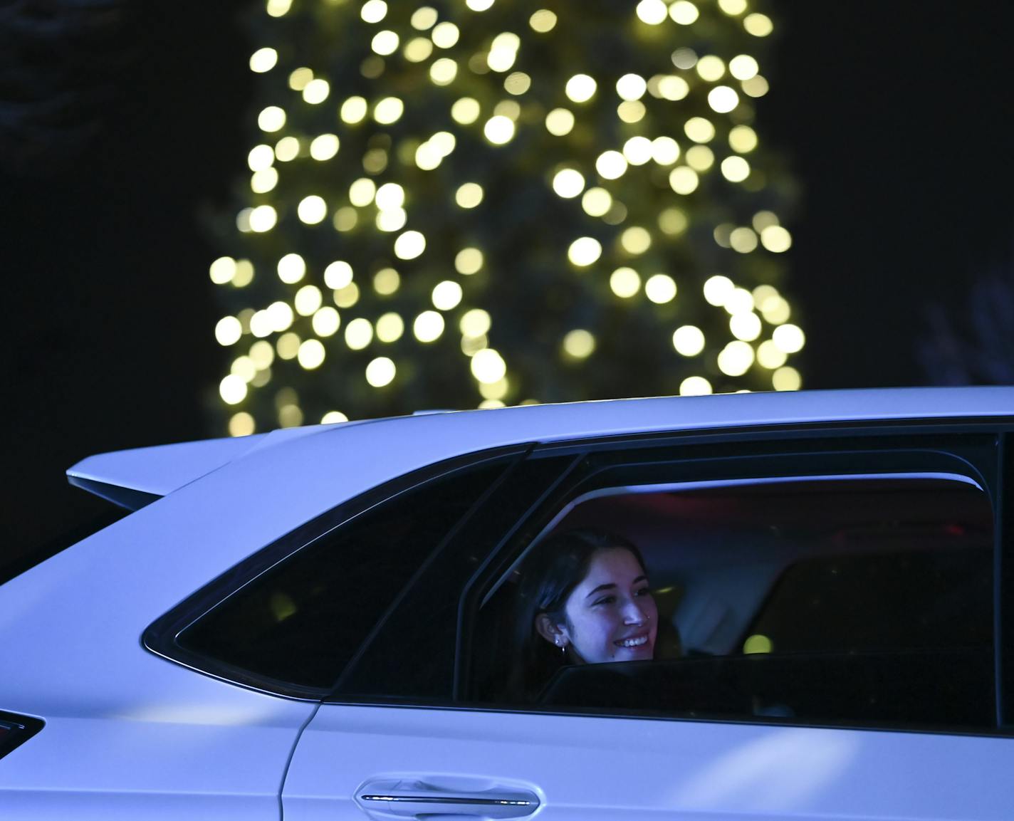 A woman took in the sights at the GLOW Holiday Festival Wednesday night. ] AARON LAVINSKY • aaron.lavinsky@startribune.com Drive-through is the name of the entertainment game this fall and winter. The GLOW Holiday Light event at the state fairgrounds is just one of the new breed of holiday light shows coming onboard in 2020. We photograph the GLOW Holiday Festival on Wednesday, Nov. 18, 2020 in Falcon Heights, Minn.