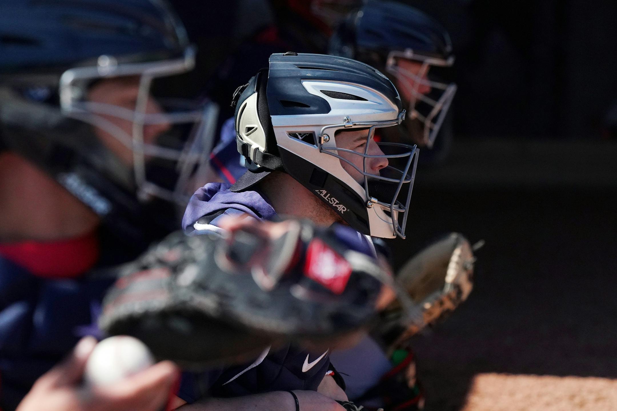 Twins catcher Mitch Garver (18) worked out with his fellow catchers in the bullpen at Hammond Stadium Thursday morning.