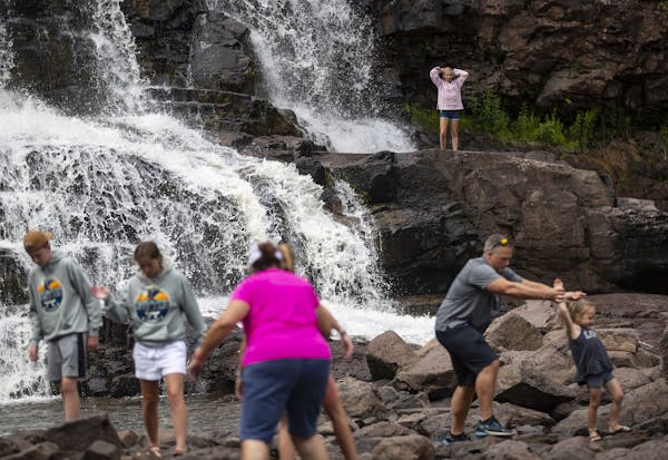 A large group of visitors stopped to enjoy Gooseberry Falls on Tuesday despite the pandemic.