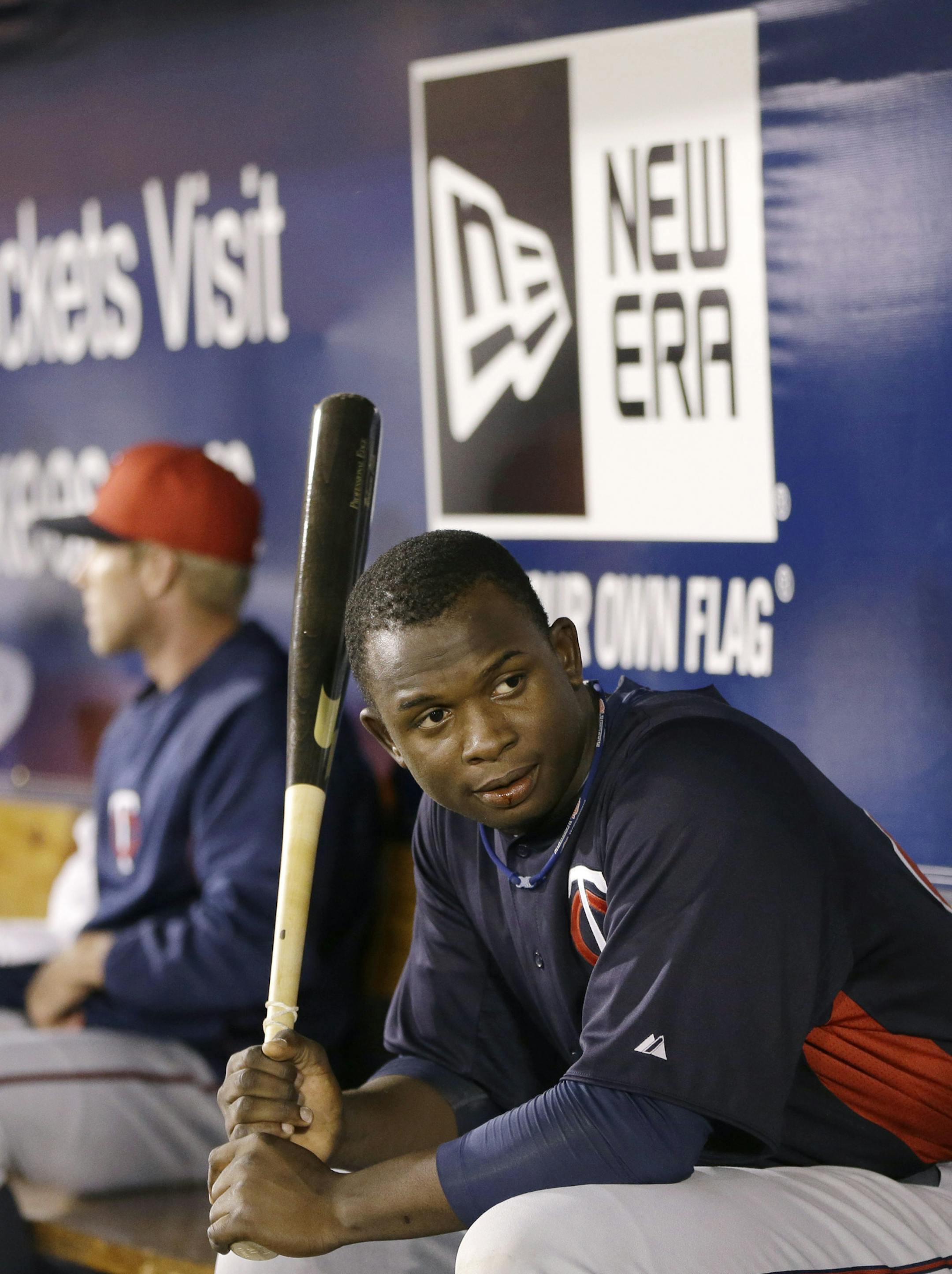 Minnesota Twins top prospect Miguel Sano in the dugout in a spring training baseball game in Tampa, Fla., Thursday, March 21, 2013. (AP Photo/Kathy Willens)