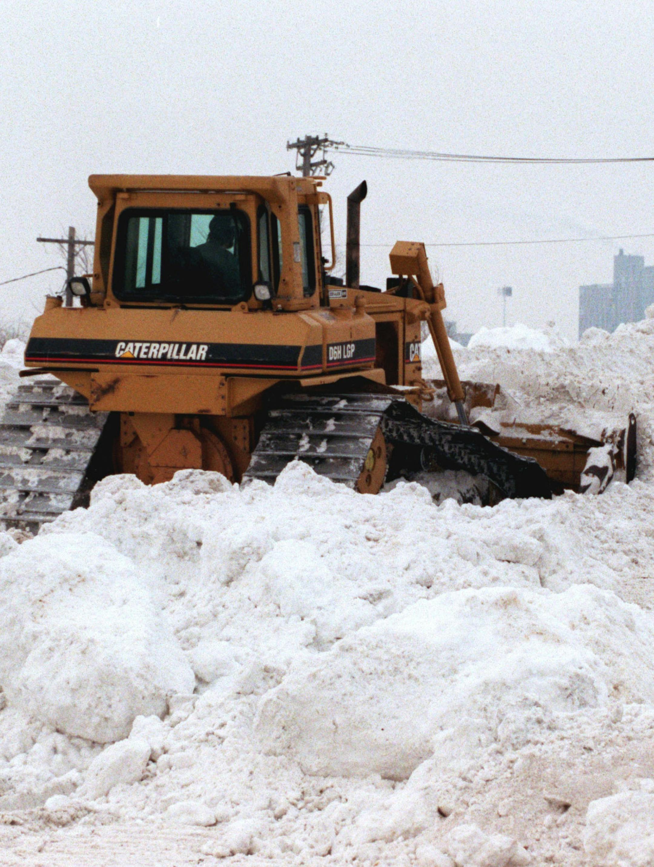 Problems of snow in the metro area -- The city of Minneapolis is using the property along Minnehaha Avenue north of Lake Street as its snow dump site. An estimated 100 to 200 dump truck loads of snow each day have been dumped on the area since the snow started in November. Much of the snow removal is done during the night to avoid problems with traffic.