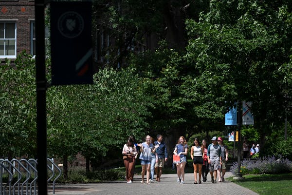 Student worker Leah Wasson, second from left, led a group of prospective students on a campus tour at Macalester College in St. Paul last week. Colleg