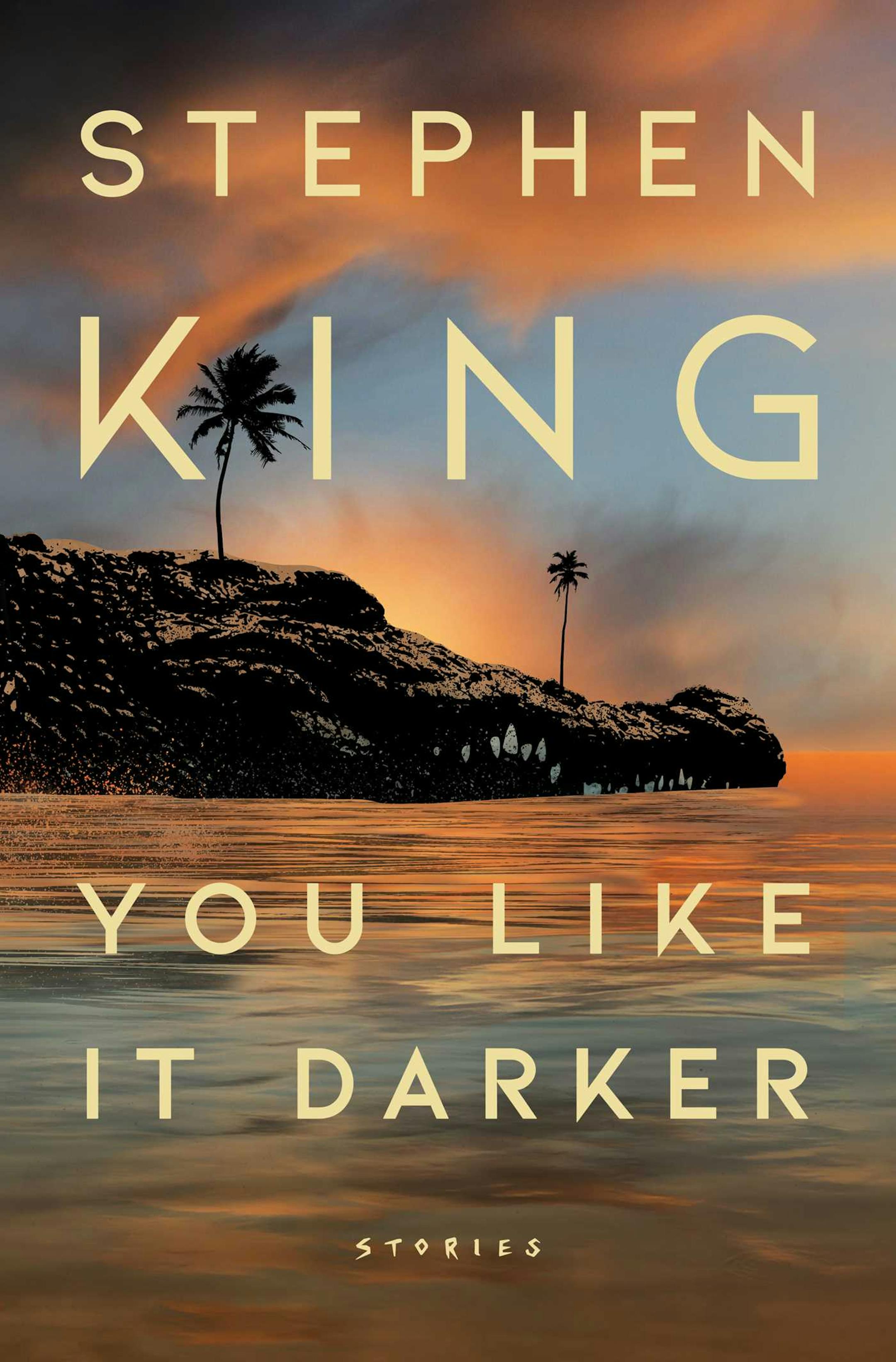 cover of You Like It Darker features a rocky shore, with palm trees