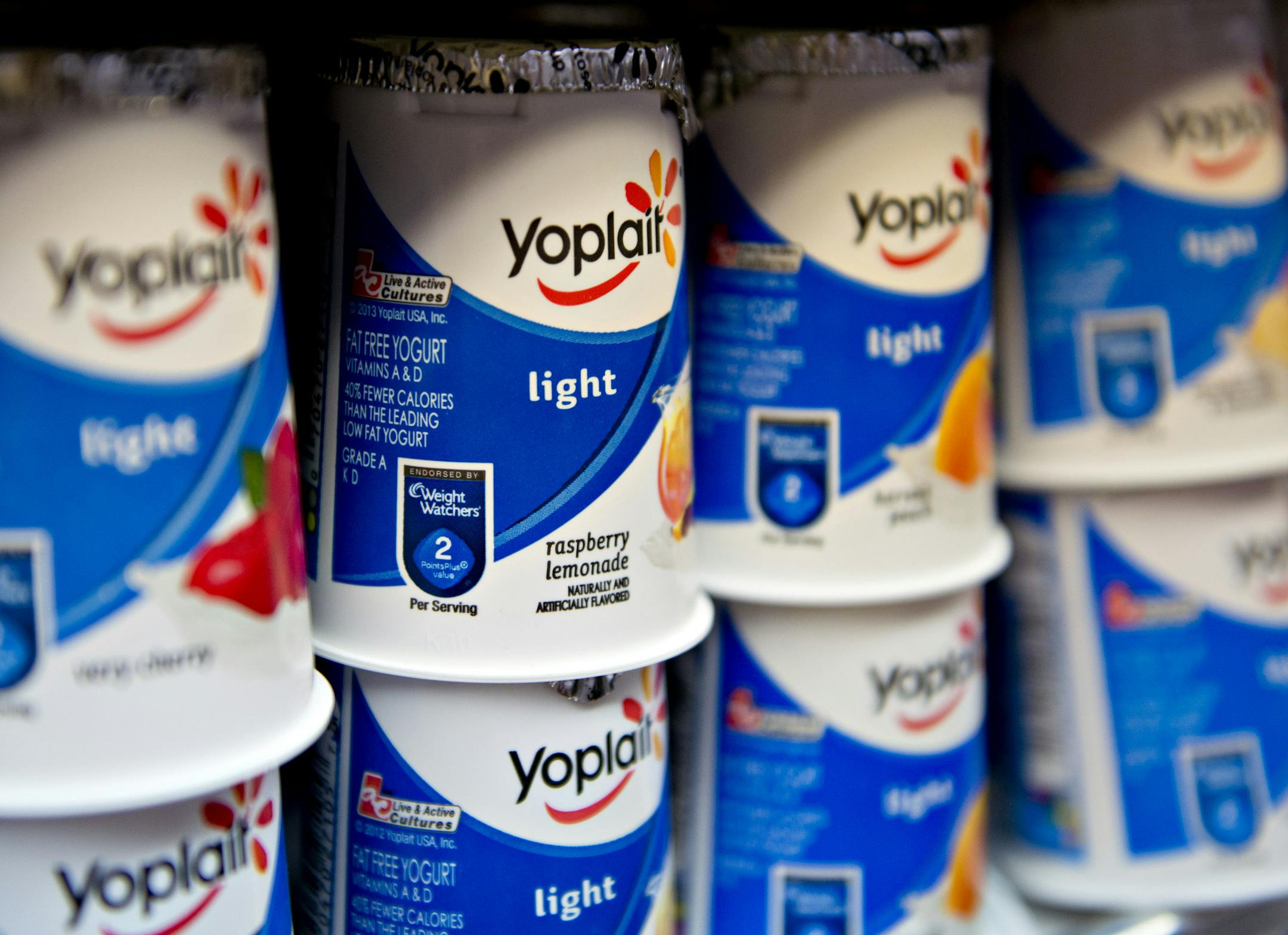 General Mills Inc. Yoplait brand yogurt sits on display at a supermarket in Princeton, Illinois, U.S., on Tuesday, Sept. 17, 2013. General Mills, Inc., said net sales rose 8 percent to $4.37 billion. Photographer: Daniel Acker/Bloomberg ORG XMIT: 181327218