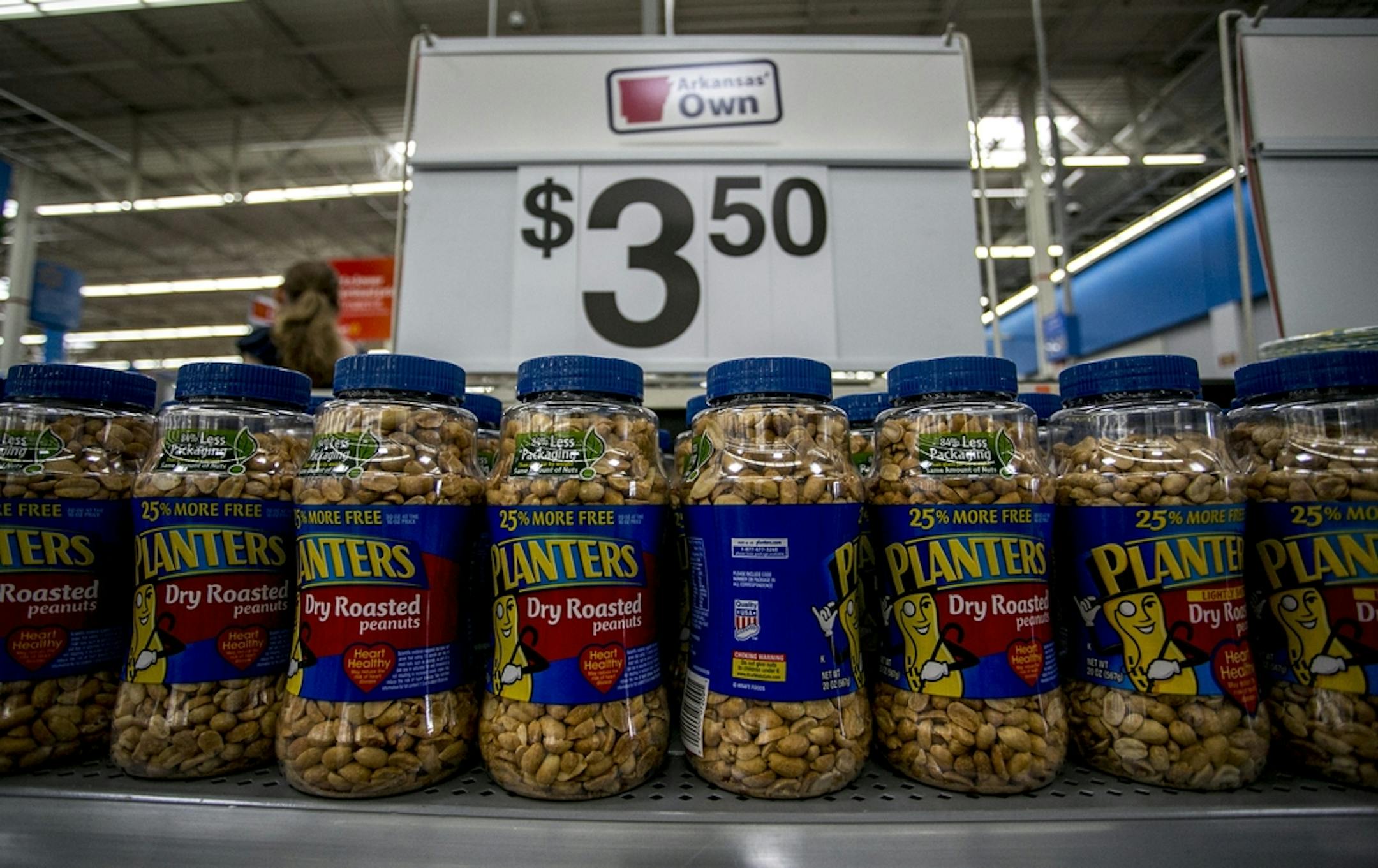 CORRECTS LOCATION TO ROGERS ARK. INSTEAD OF BENTONVILLE - An Arkansas Own display of Planters Peanuts lines the entrance of a Walmart store in Rogers, Ark., Friday, June 7, 2013. Items from Wal-mart's Arkansas Own collection were made within 100 miles from the store they are placed in. (AP Photo/Gareth Patterson) ORG XMIT: ARGP104