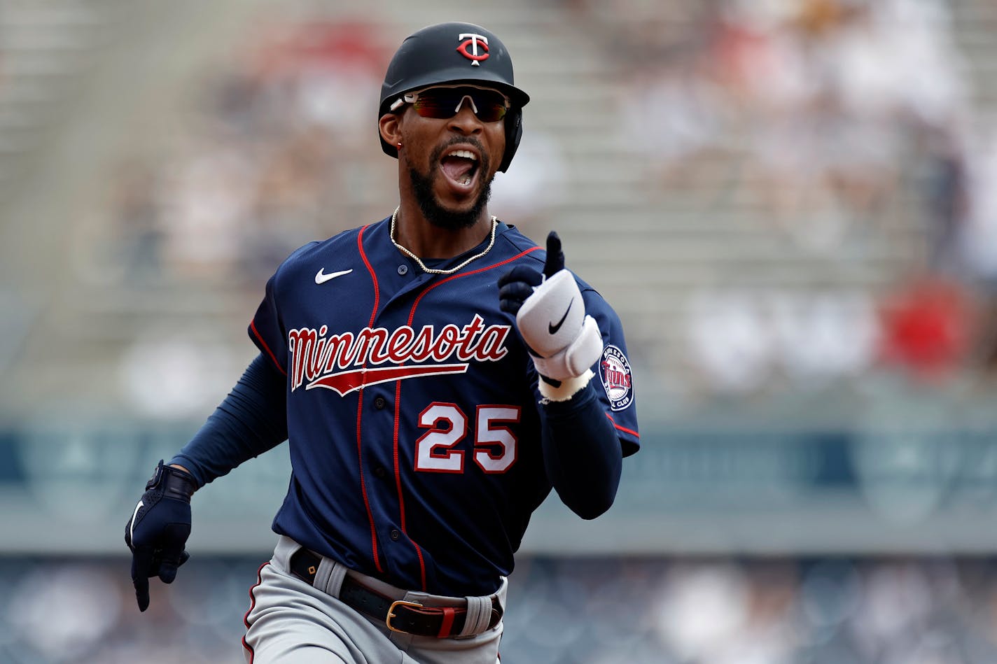 Minnesota Twins' Byron Buxton reacts while rounding the bases after hitting a home run against the New York Yankees during the third inning of a baseball game on Monday, Sept. 13, 2021, in New York. (AP Photo/Adam Hunger)