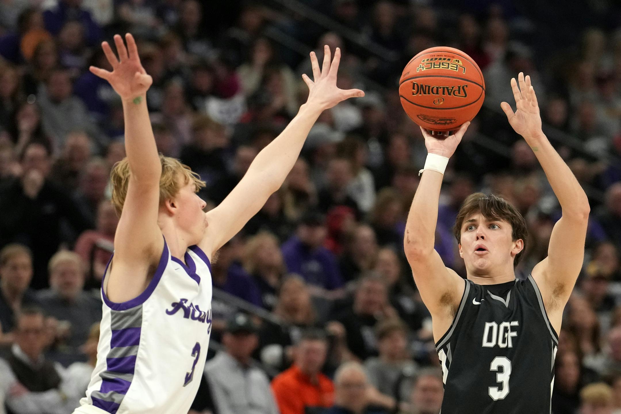 DGF guard Drew Sheeley (3) hits the three point shot as Albany guard Carter Voss (3) leaps to defend in the second half.