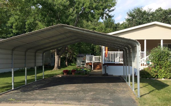 A carport the size of a two-car garage sits outside Kathryn Eich&#x2019;s home in the Rambush Estates mobile home park in Burnsville. The city says it