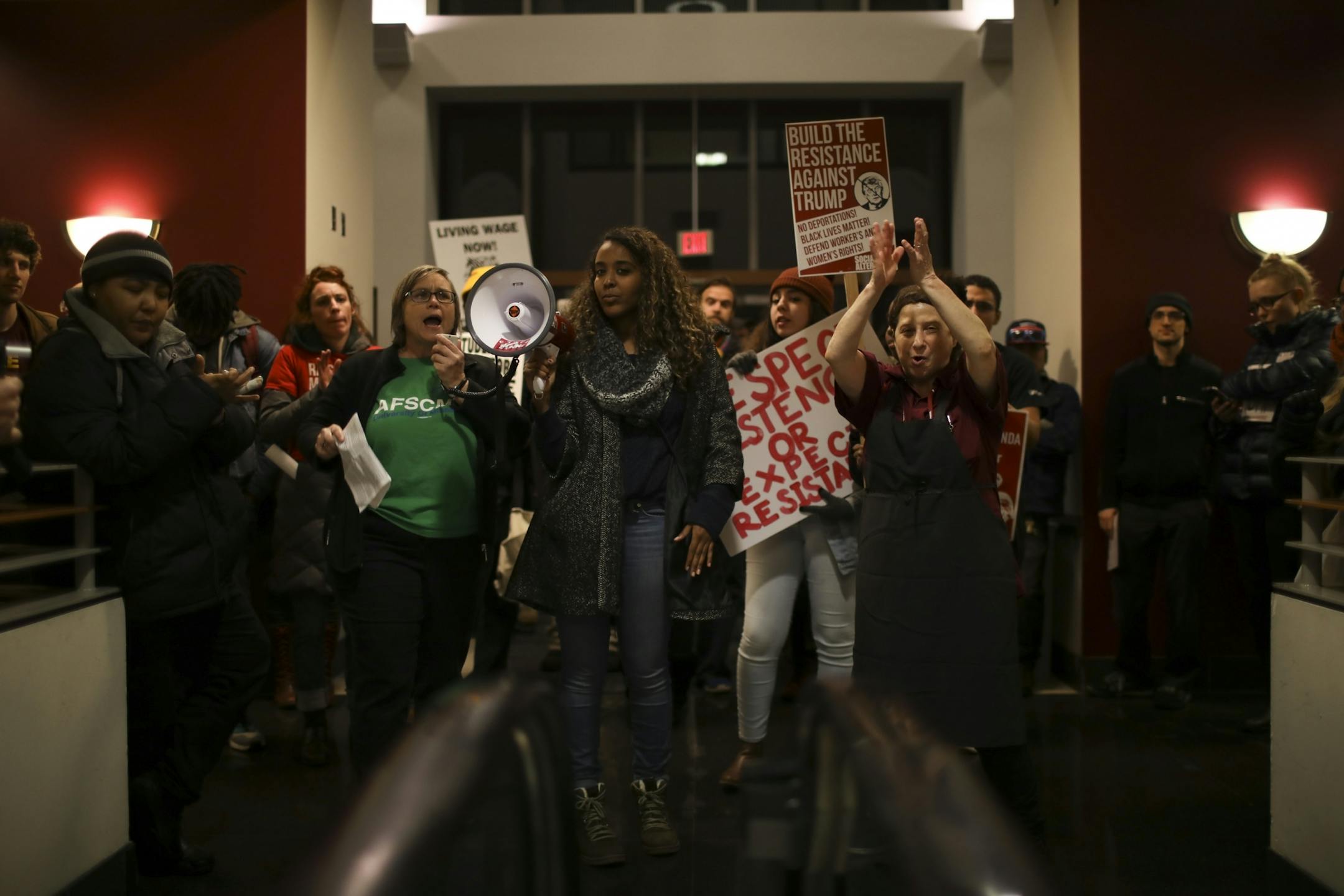 Demonstrators began by listening to speakers at a rally inside Coffman Union.