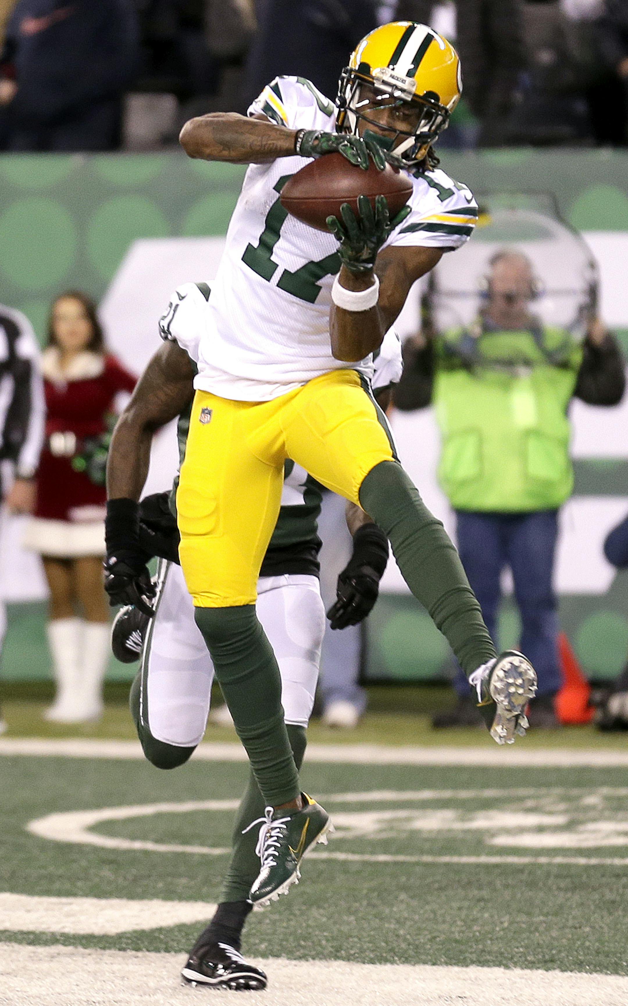 Green Bay Packers wide receiver Davante Adams (17) makes game-winning touchdown catch in front of New York Jets cornerback Morris Claiborne during overtime of an NFL football game, Sunday, Dec. 23, 2018, in East Rutherford, N.J. The Packers won 44-38 in overtime. (AP Photo/Seth Wenig)
