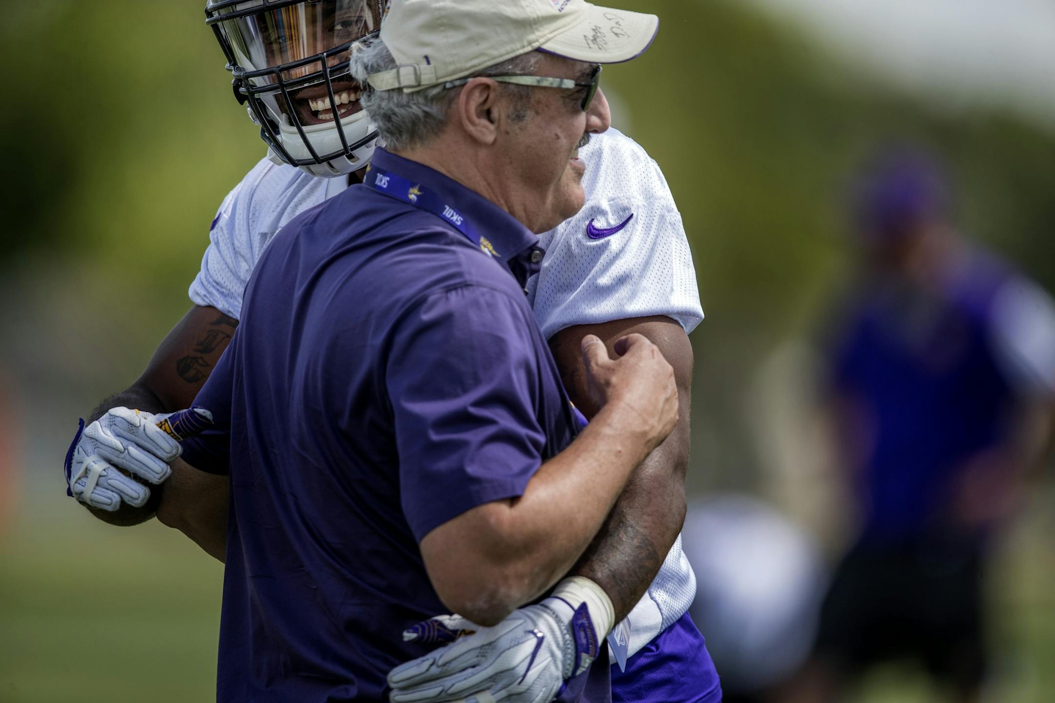 Minnesota Vikings defensive lineman Everson Griffen hugged team owner Ziggy Wilf during the afternoon practice. Griffen just signed a contract extension.
