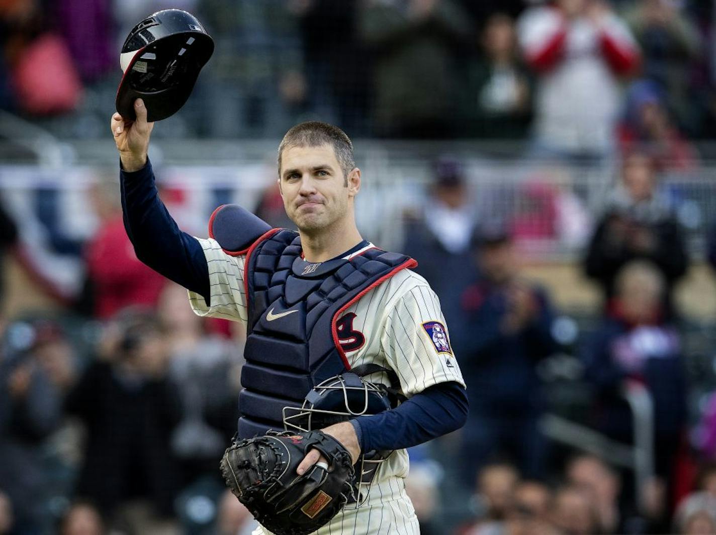 Minnesota Twins' Joe Mauer received an ovation as he left the game after catching one pitch in the ninth inning against the Chicago White Sox on Sunday, Sept. 30, 2018 at Target Field in Minneapolis, Minn.