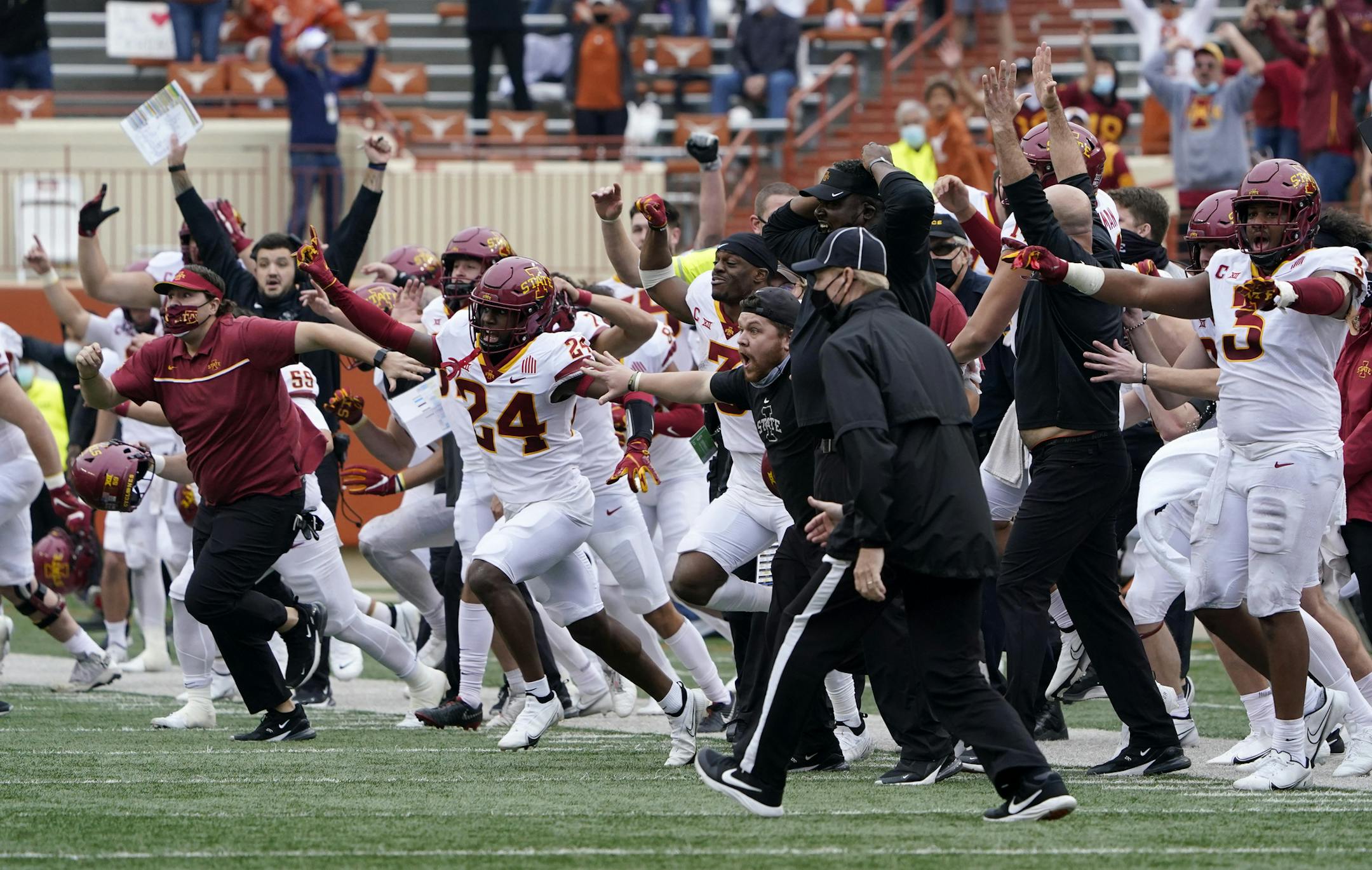 Iowa State players and coaches ran onto the field after Texas' Cameron Dicker missed a tying 58-yard field goal Friday. The Cyclones, seeking their first conference championship since sharing the 1912 Missouri Valley title with Nebraska, beat the Longhorns 23-20.