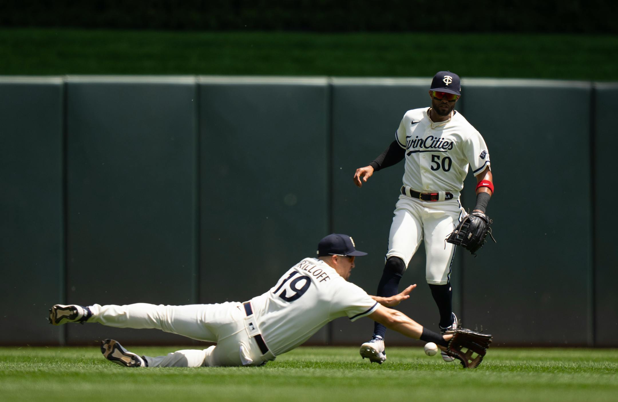 Minnesota Twins left fielder Alex Kirilloff (19) couldn't make the catch on a Toronto Blue Jays catcher Alejandro Kirk (30) fly ball in the second inning, allowing to RBI's. He was backed up by Twins center fielder Willi Castro (50).