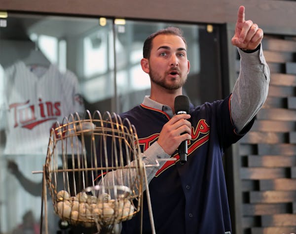 Twins pitcher Chase De Jong called out numbers for bingo games at TwinsFest.