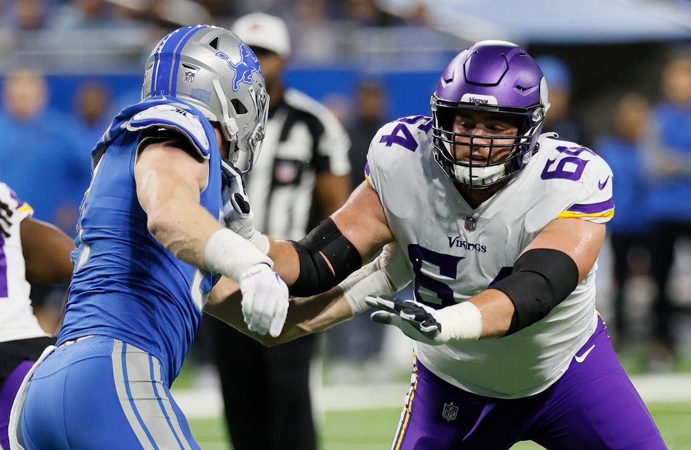 Minnesota Vikings offensive tackle Blake Brandel (64) blocks against Detroit Lions defensive end Aidan Hutchinson (97) during the first half of an NFL football game, Sunday, Dec. 11, 2022, in Detroit. (AP Photo/Duane Burleson)