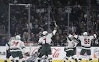The Minnesota Wild celebrate a goal by left wing Tyler Ennis, second from right, during the second period of an NHL hockey game agains the Los Angeles