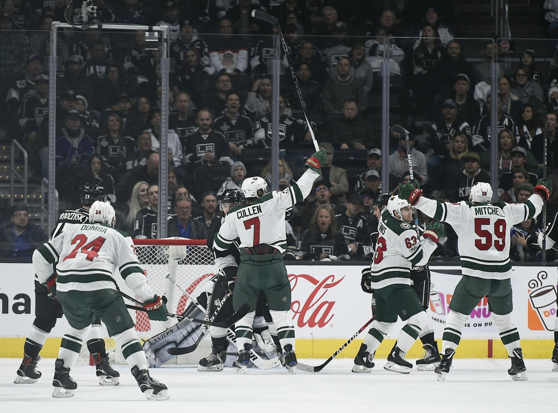 The Minnesota Wild celebrate a goal by left wing Tyler Ennis, second from right, during the second period of an NHL hockey game agains the Los Angeles Kings in Los Angeles, Tuesday, Dec. 5, 2017.