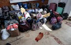 Passenger luggage and bloodstains remain inside the Kramatorsk train station in eastern Ukraine on Sunday. More than 50 people were killed on Friday i
