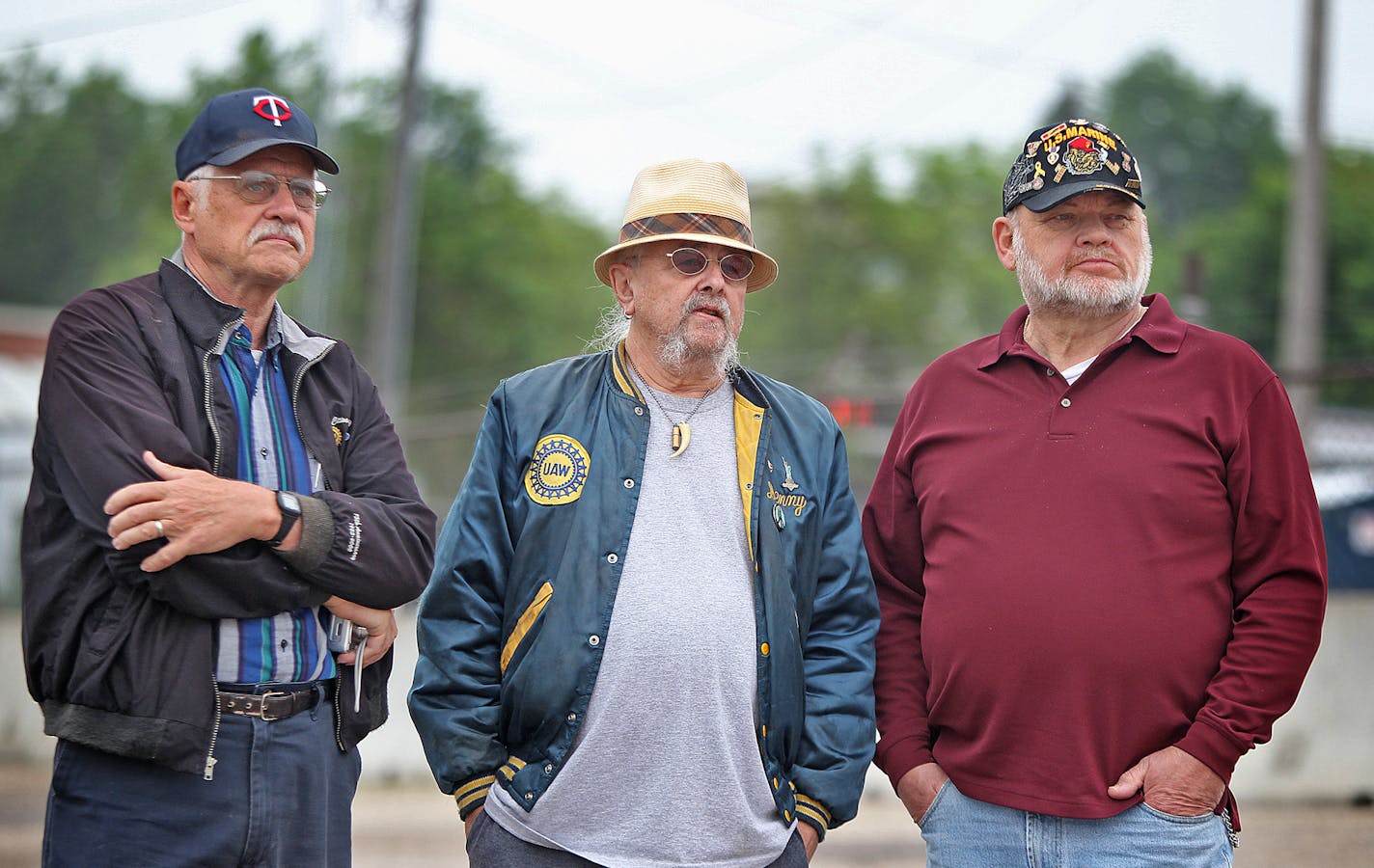 Dale Conrad, left, and Denny Dickhausen, center, both of whom worked at the Ford plant for nearly 40 years, and Herb Johnson watched as demolition began Monday on the 122-acre former Twin Cities Ford Assembly Plant in the Highland Park area of St. Paul.