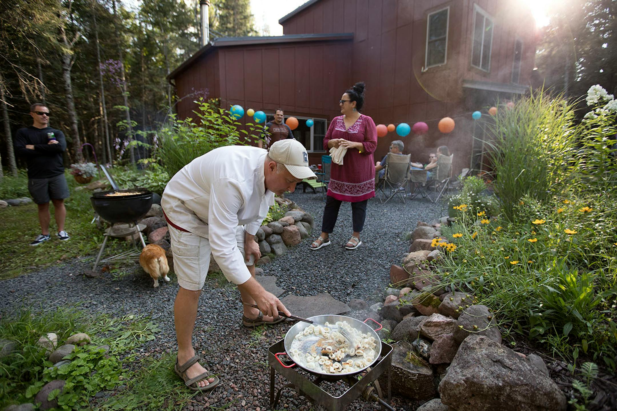 Kristine and Tom Anderson's cabin is a perfect location for a paella party,