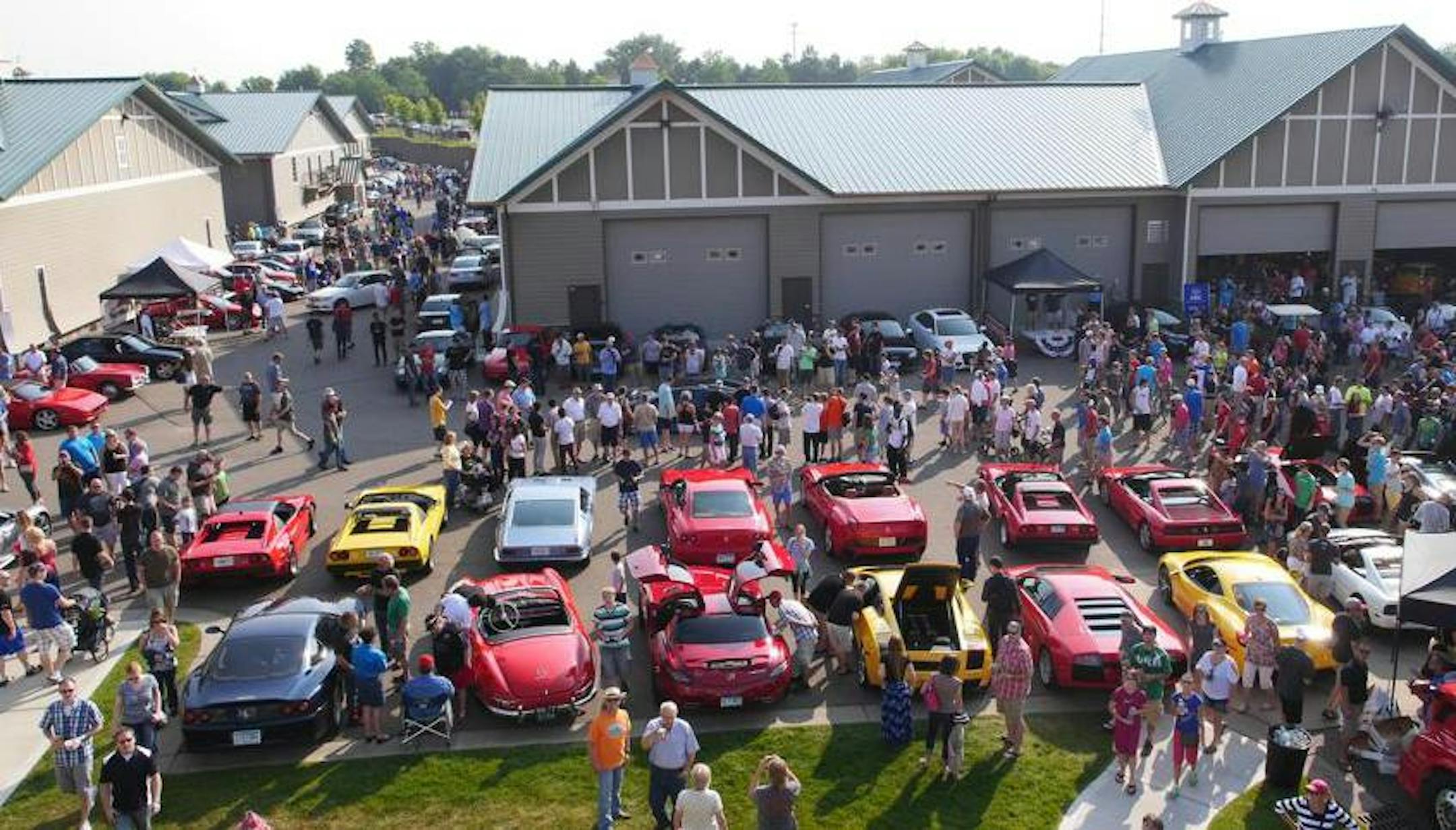 An aerial photo of a Cars and Coffee event at the Chanhassen AutoMotorPlex last spring.