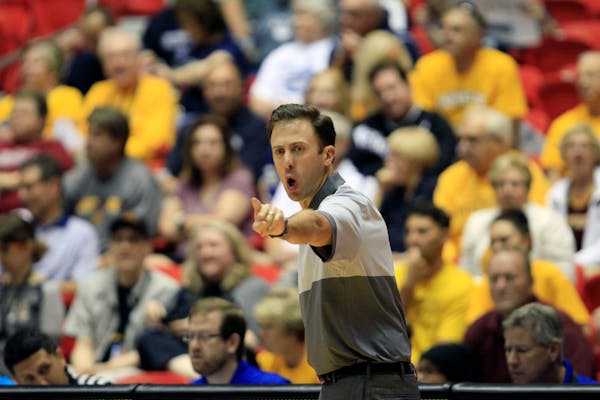 Richard Pitino instructs players during the Puerto Rico Tip-Off.