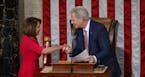Nancy Pelosi of California shakes hands with House Minority Leader Kevin McCarthy, R-Calif., after being elected House speaker at the Capitol in Washi