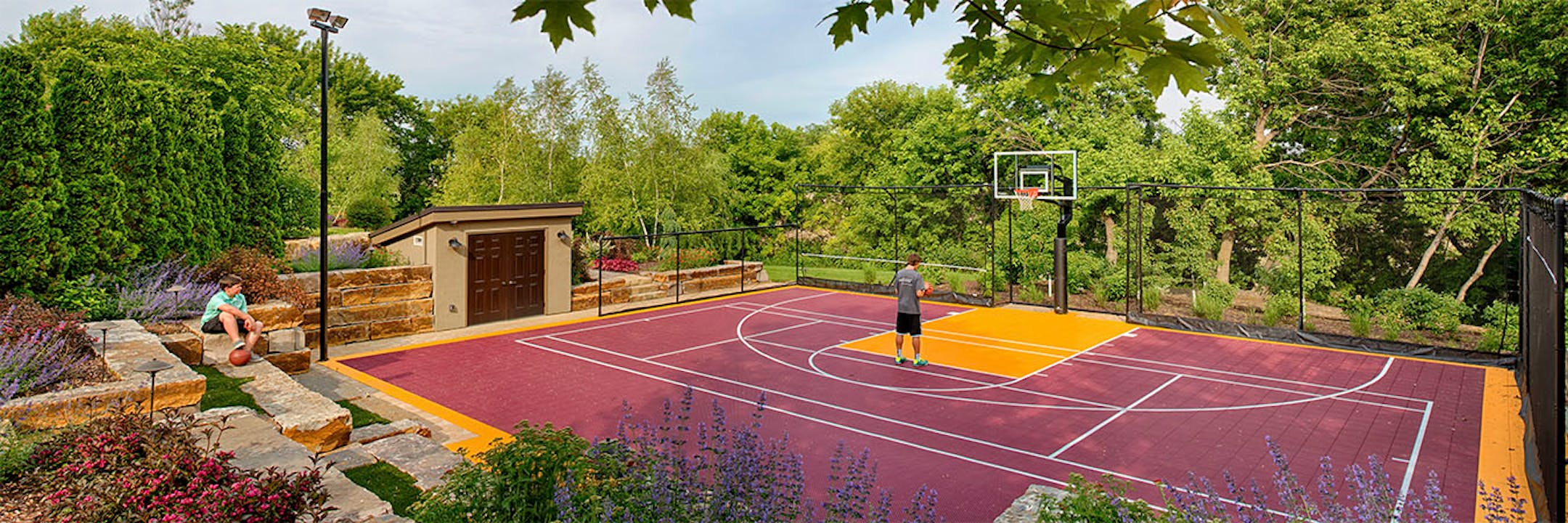 The backyard includes a sport court.