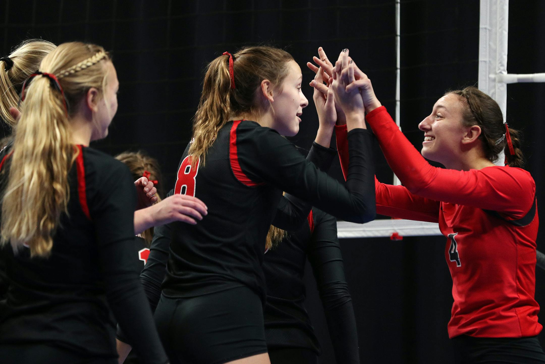 Mayer Lutheran High School's Mya Chmielewski (4) celebrated with Olivia Tjernagel (8) after winning the championship game. ] ANTHONY SOUFFLE ï anthony.souffle@startribune.com Game action from a Class 1A championship volleyball game between Mayer Lutheran High School and Minneota High School Saturday, Nov. 11, 2017 at the Xcel Energy Center in St. Paul, Minn.
