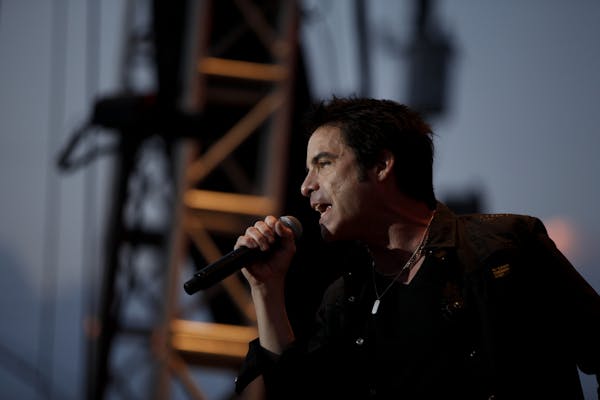Patrick Monahan, the lead singer of Train, sings as one of the final acts at the 18th annual Cities 97 Basilica Block Party in Minneapolis, Minn. on F