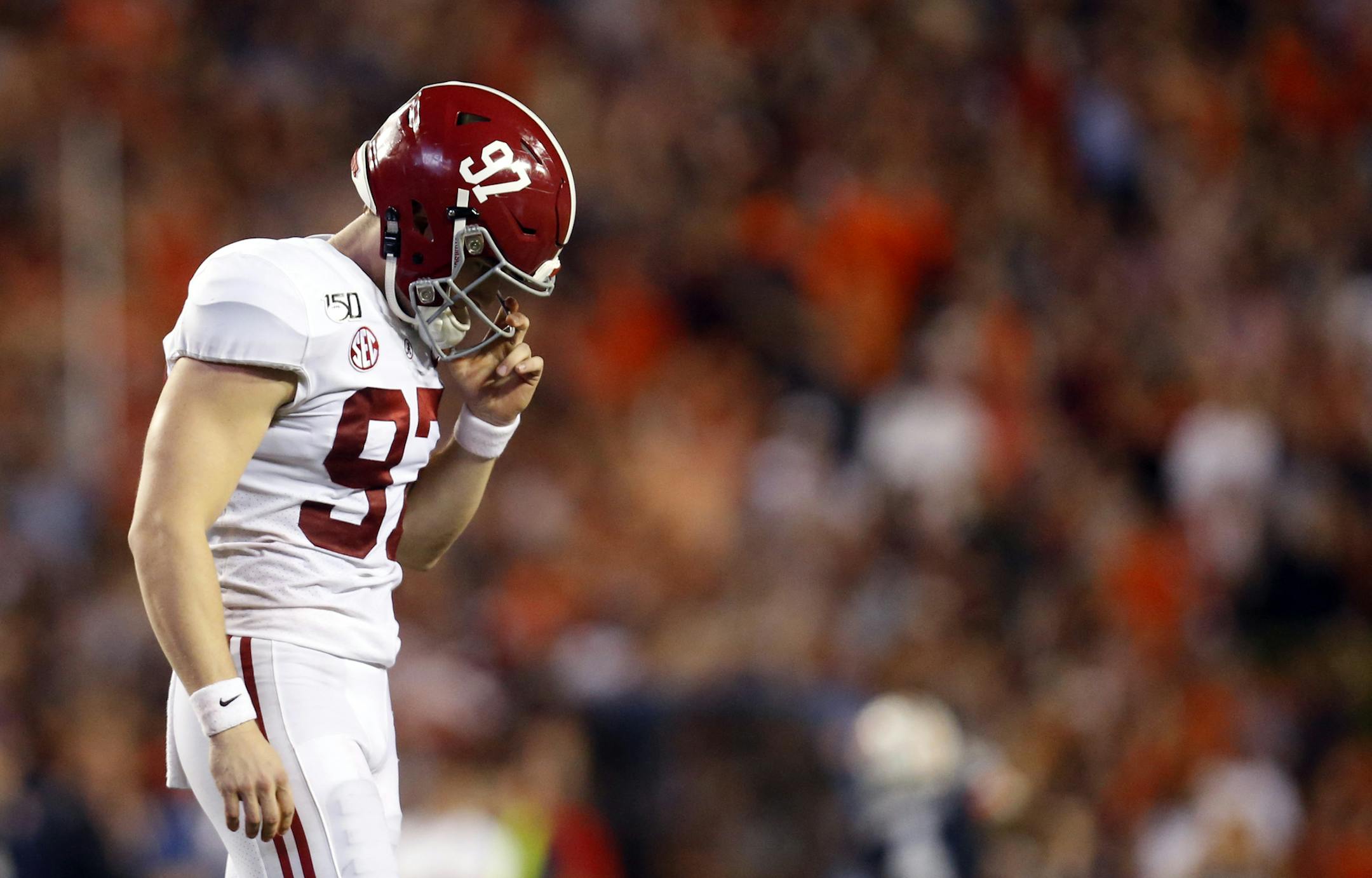 Alabama place kicker Joseph Bulovas (97) walks off the field after missing a field goal that would've tied the game late in the second half of an NCAA college football game against Auburn, Saturday, Nov. 30, 2019, in Auburn, Ala. Auburn won 48-45. (AP Photo/Butch Dill)