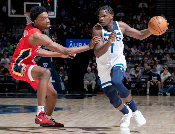 Anthony Edwards (1) of the Minnesota Timberwolves is defended by Herbert Jones (5) of the New Orleans Pelicans in the fourth quarter Monday, Oct. 25 a
