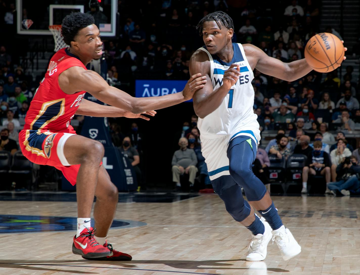 Anthony Edwards (1) of the Minnesota Timberwolves is defended by Herbert Jones (5) of the New Orleans Pelicans in the fourth quarter Monday, Oct. 25 at Target Center in Minneapolis, Minn. ] CARLOS GONZALEZ • cgonzalez@startribune.com – Minneapolis, Minn., October 25, 2021, Target Center, NBA, Minnesota Timberwolves vs. New Orleans Pelicans