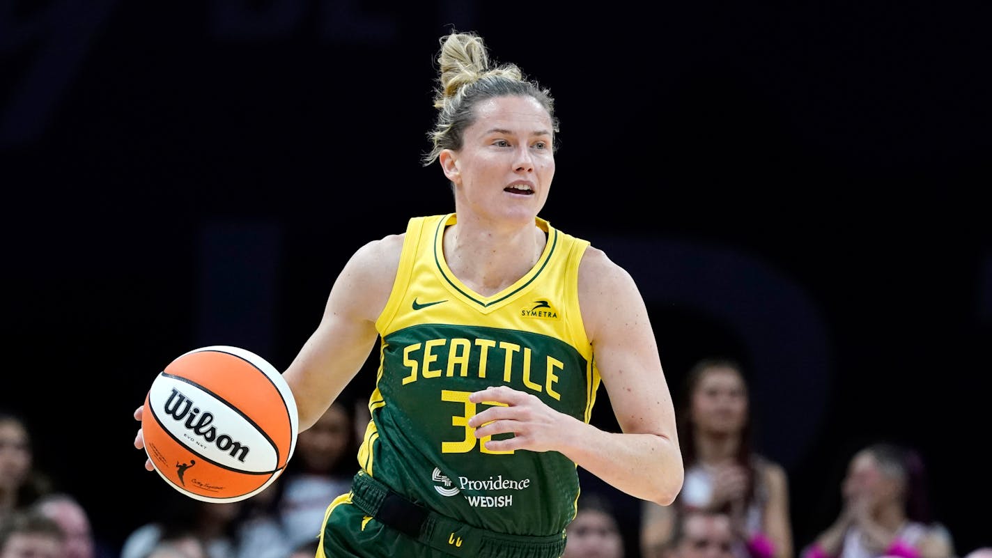 Seattle Storm's Sami Whitcomb dribbles the ball against the Phoenix Mercury during the first half of a WNBA basketball game Saturday, Aug. 5, 2023, in Phoenix. (AP Photo/Ross D. Franklin)