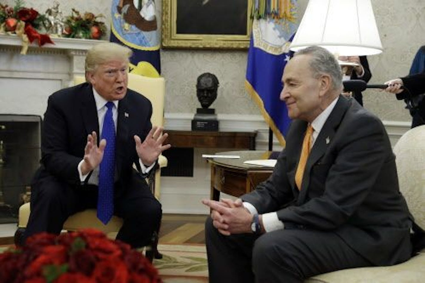 President Donald Trump meets with Senate Minority Leader Chuck Schumer, D-N.Y., right, and House Minority Leader Nancy Pelosi, D-Calif., not shown, in the Oval Office of the White House, Tuesday, Dec. 11, 2018, in Washington.