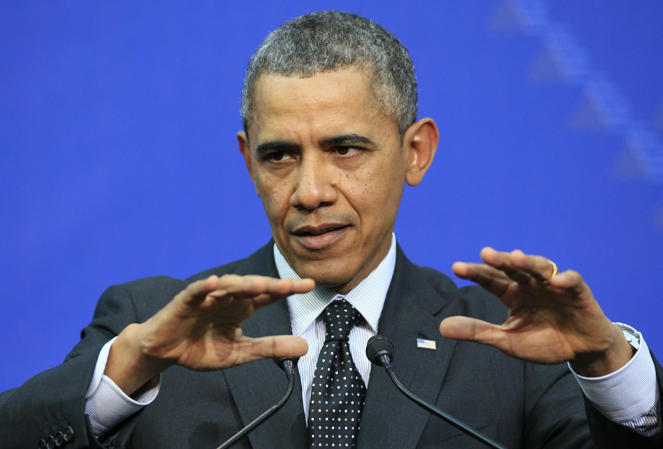 U.S. President Barack Obama addresses the media at the end of the Nuclear Summit in The Hague, the Netherlands, on Tuesday, March 25, 2014. President Barack Obama says there's no expectation that Russian forces will be dislodged from Crimea by force. (AP Photo/Yves Logghe)