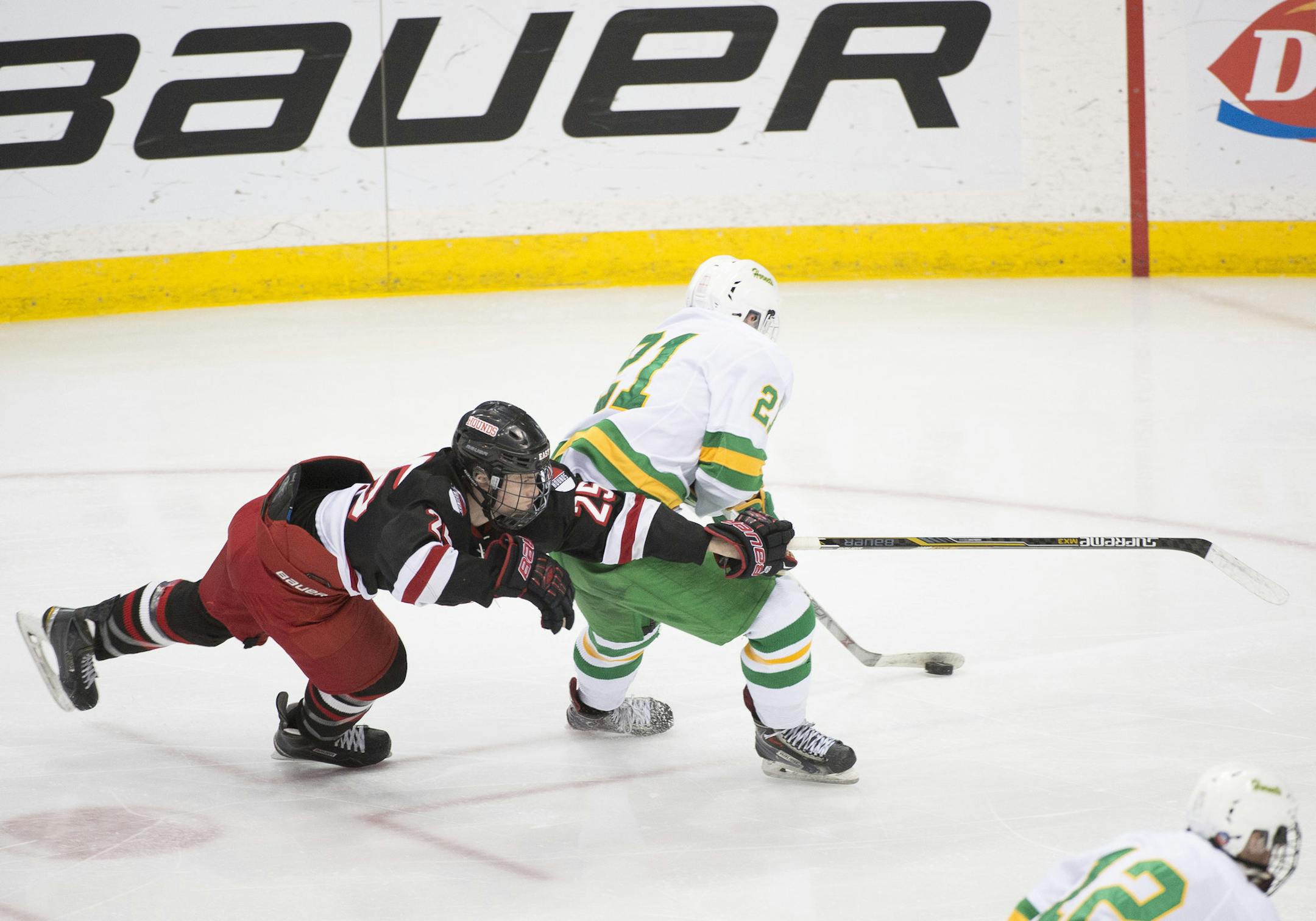 Duluth East defender Luke LaMaster (25) goes horizontal while defending against Edina forward Henry Bowlby (21) as he charges toward the goal in the second period. ] (Aaron Lavinsky | StarTribune) Duluth East plays against Edina in the Class 2A semifinals on Friday, March 6, 2015 at Xcel Energy Center.