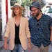 This image released by Lionsgate shows Charlize Theron, left, and Seth Rogen in a scene from "Long Shot." (Hector Alvarez/Lionsgate via AP)
