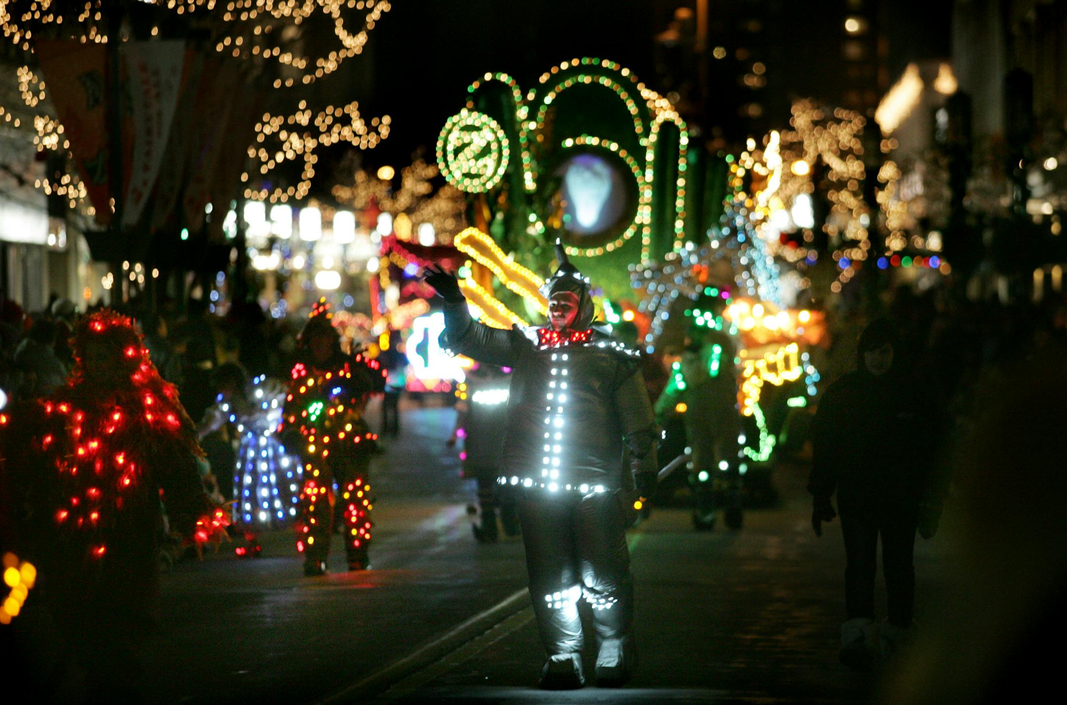 The Tin Man from the Wizard of Oz, center, entertained the crowds along Nicollet Mall during the Holidazzle parade.