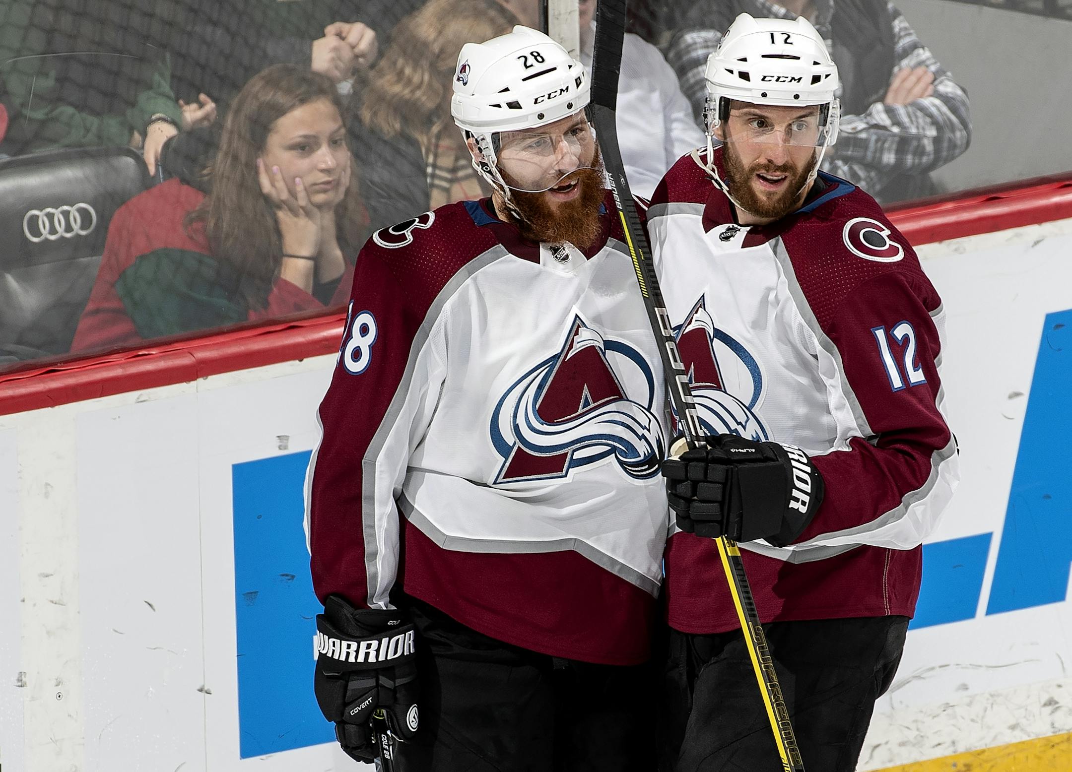 Ian Cole (28) celebrated with Patrik Nemeth (12) after scoring an empty net goal in the third period.