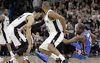 Oklahoma City Thunder forward Kevin Durant , right, loses an in bound pass to San Antonio Spurs guard Danny Green, left, during the second half in Gam
