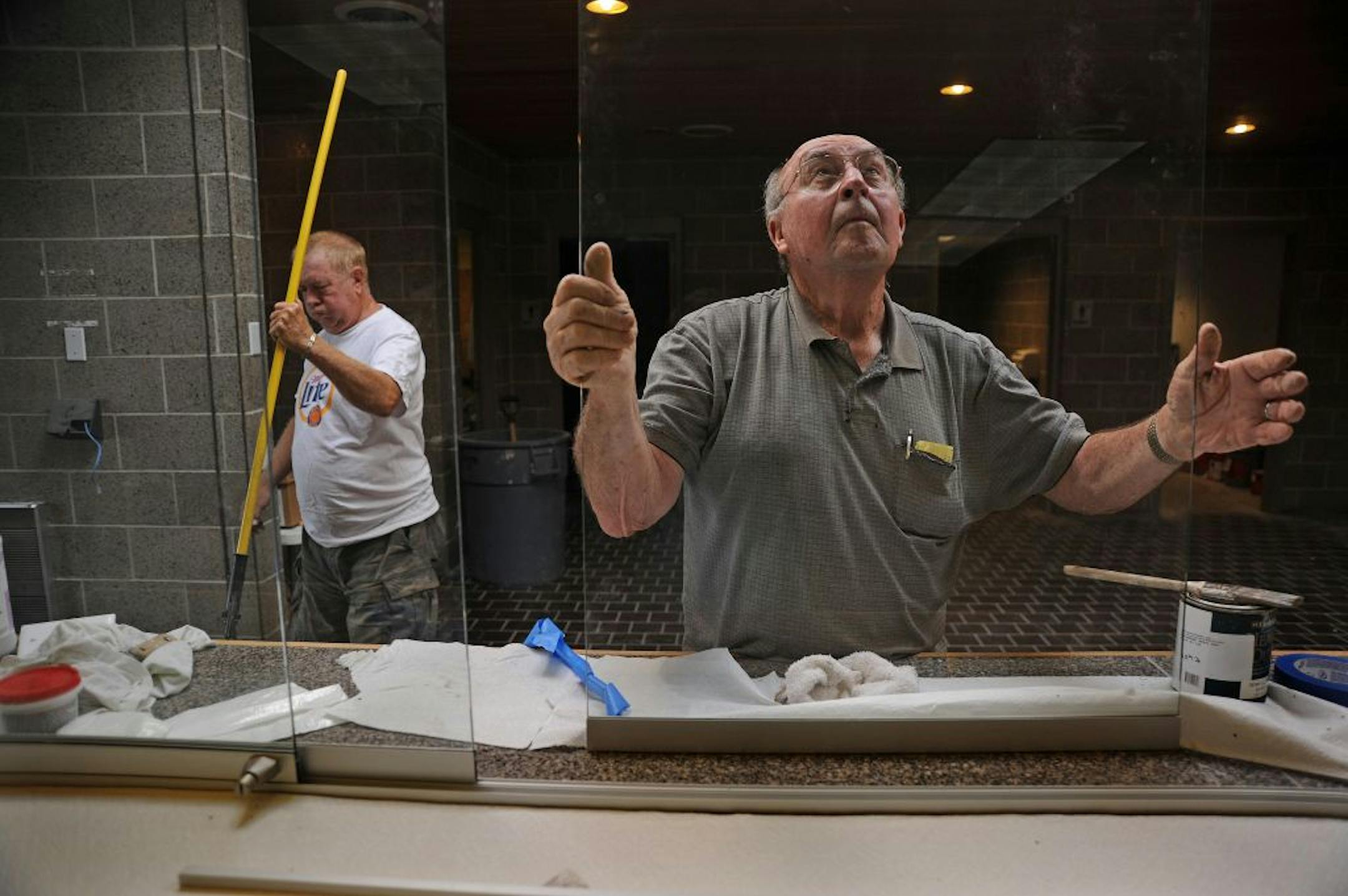 After about four months of renovation and a year of City Council debate, the new Heritage Center in Lakeville is starting to fill with senior citizens, veterans and historical society members and their office equipment.�I�m trying to line up people to do a final cleanup and some painting,� said Wally Potter, a volunteer organizer who has helped keep project costs to just under $1.1 million. Wally Potter adjusted a sliding glass window in the main lobby area while Richard Hopkins mopped the floo