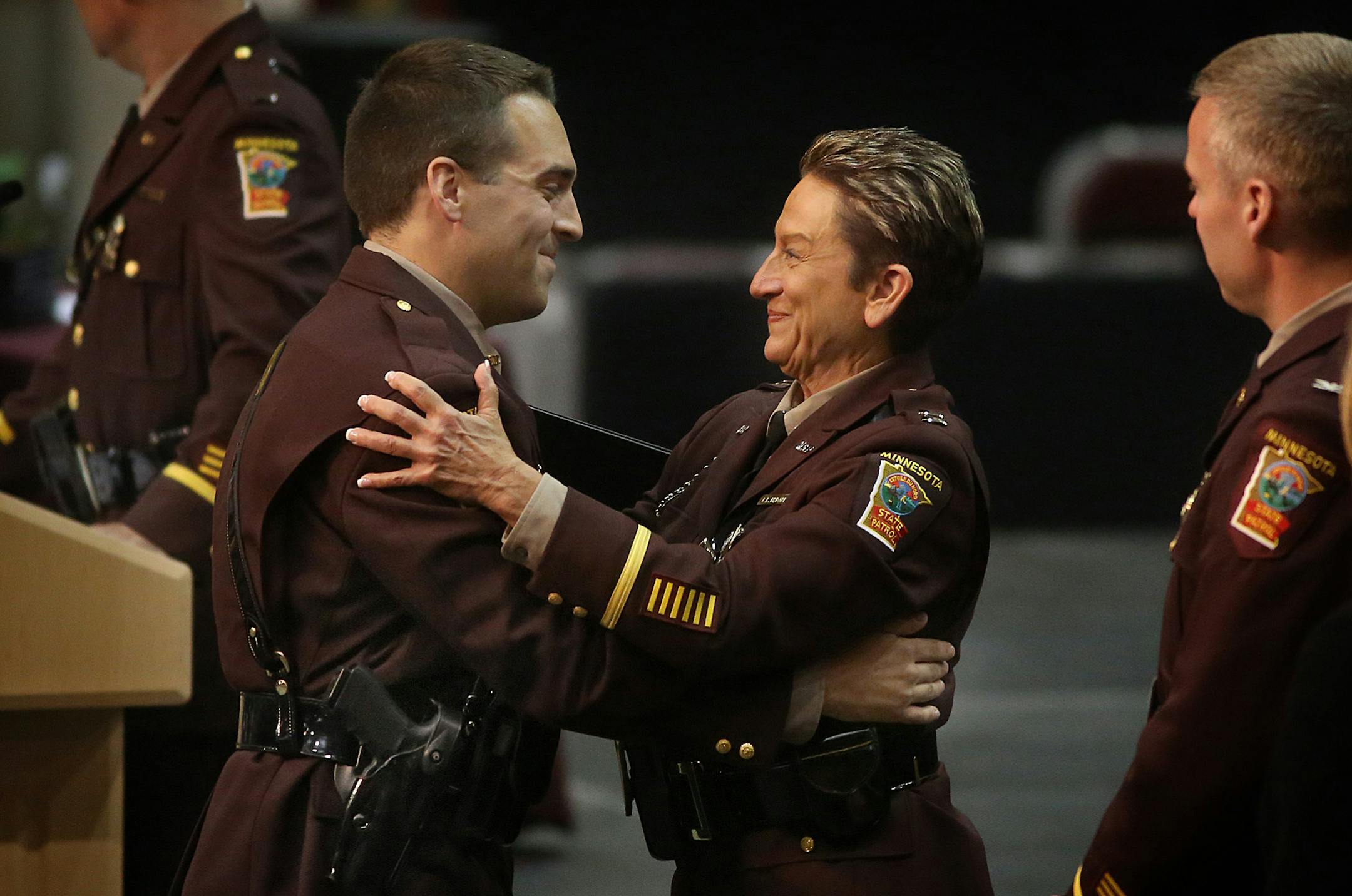Minnesota State Patrol cadet Nathan Hodapp embraced his Captain Lori Hodapp, during the graduation ceremony. Lori Hodapp is the director of Training and Development for the Minnesota State Patrol. ]JIM GEHRZ ï james.gehrz@startribune.com / Minneapolis, MN / May 119, 2015 / 1:00 PM ñ BACKGROUND INFORMATION: A graduation ceremony for 50 Minnesota State Patrol cadets was held at Mariucci Arena Tuesday, with five having other family members who are or were also in the State Patrol. Legacy