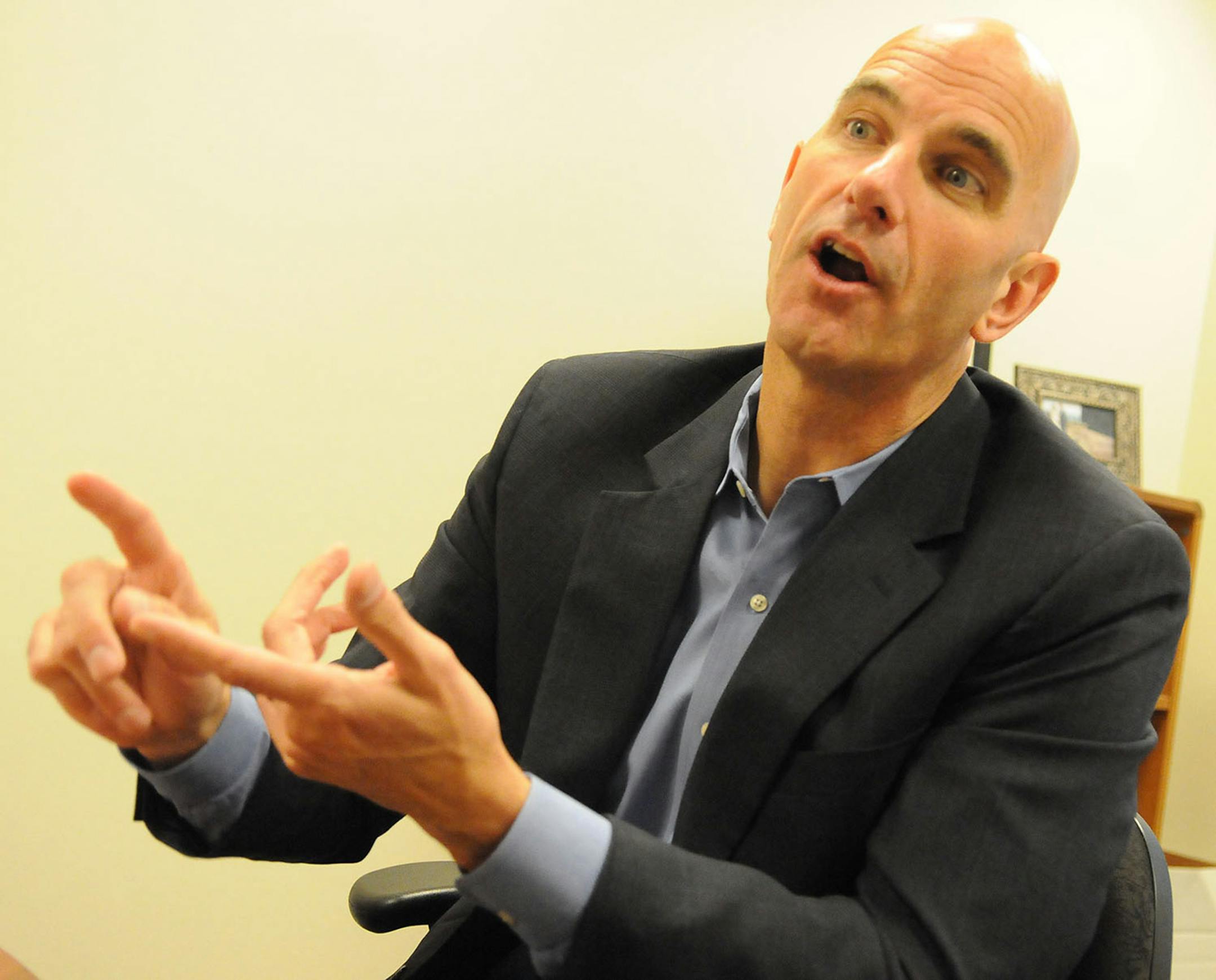 Genesys Works Executive Director Jeff Tollefson explains his various theories of education and work to ThreeSixty interviewers Isabel Loisef and Danielle Wong in his St Paul office Thursday morning June 19, 2014. Photo by John Doman
