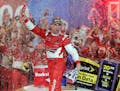 Kevin Harvick celebrates in Victory Lane after winning the NASCAR Sprint Cup series Bank of America 500 auto race at Charlotte Motor Speedway in Conco