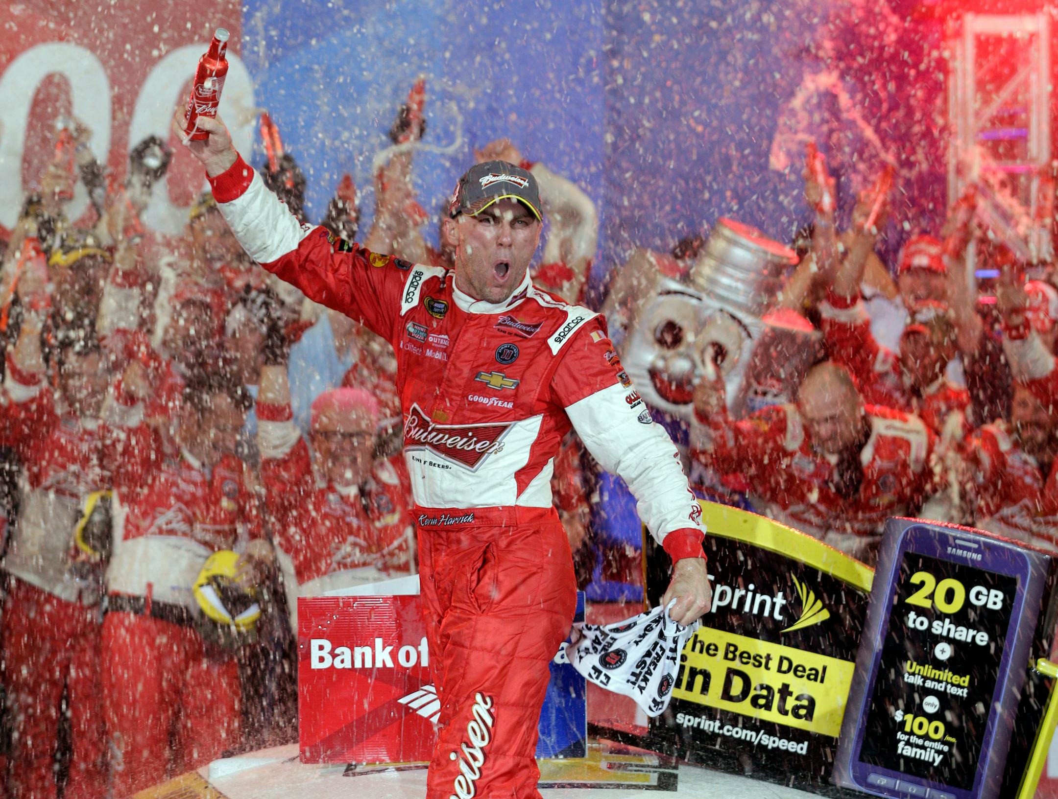 Kevin Harvick celebrates in Victory Lane after winning the NASCAR Sprint Cup series Bank of America 500 auto race at Charlotte Motor Speedway in Concord, N.C., Saturday, Oct. 11, 2014. (AP Photo/Chuck Burton)