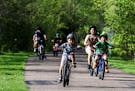 Bikers enjoy a stretch of the Bruce Vento trail that intersects with the Gateway Trail in Maplewood.